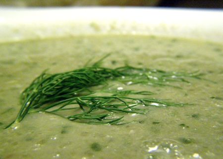 Focus on the fennel garnish in a bowl of cucumber fennel soup