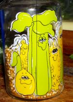 photo: a glass container with pictures of smiling fruits and vegetables